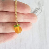 Orange Necklace, small fruit pendant, green leaf charm, orange jewelry, glass orange, translucent orange, Florida fruit, simple gold chain - Constant Baubling