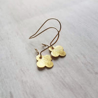 Gold Clover Earrings - small brushed 4 lobe leaf good luck charm dangle on simple latching kidney ear hook - St Patricks Day gift - Constant Baubling