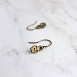 Tiny Skull Earrings, bronze skull earring, skeleton head jewelry, small skull dangle, antique brass earring, Halloween earring, trick treat - Constant Baubling